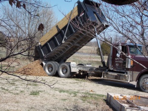 dump truck dumping soil
